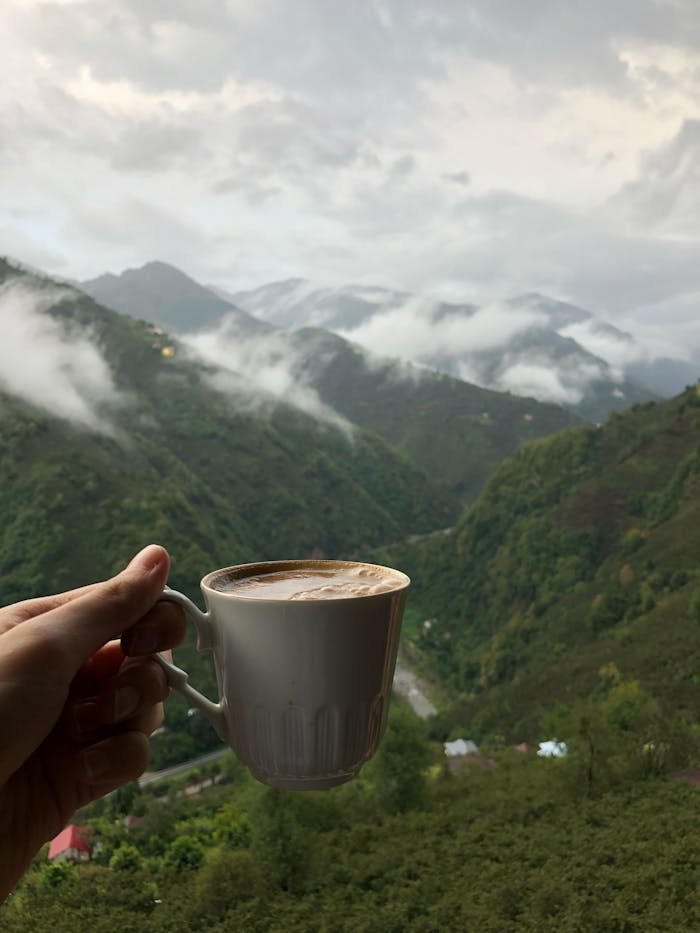 Enjoy a warm coffee with a breathtaking view of misty mountains in Oyraca, Giresun, Turkey.